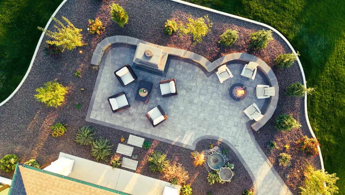 Overhead view of the full Caldwell patio, lawn edge, and plantings