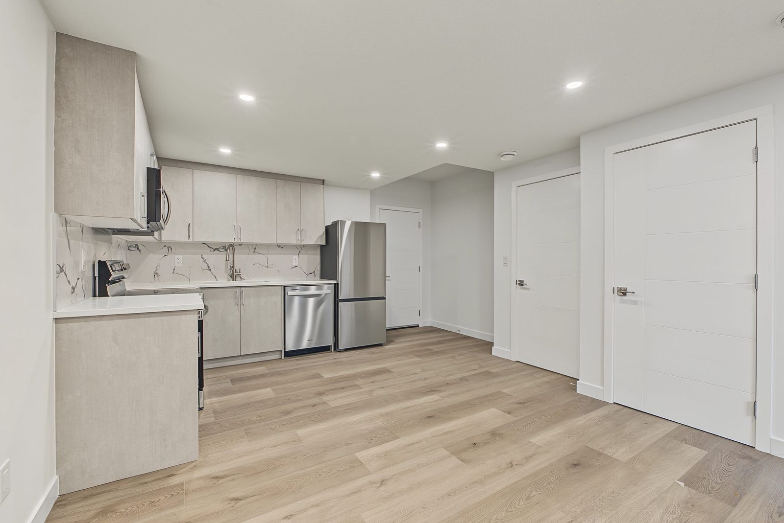 Kitchen and the hall toward the bedroom and bathroom doors