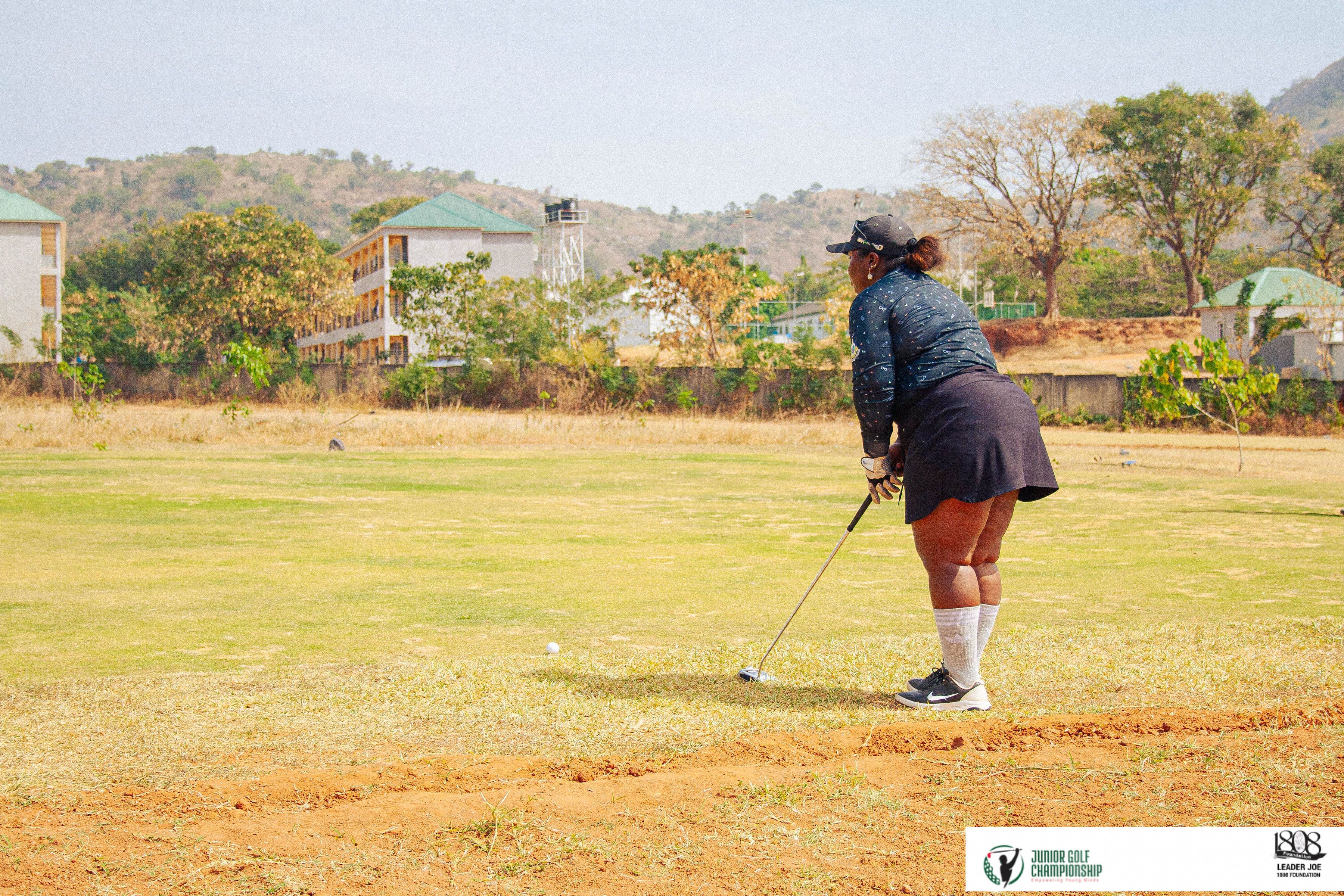 Woman golfing