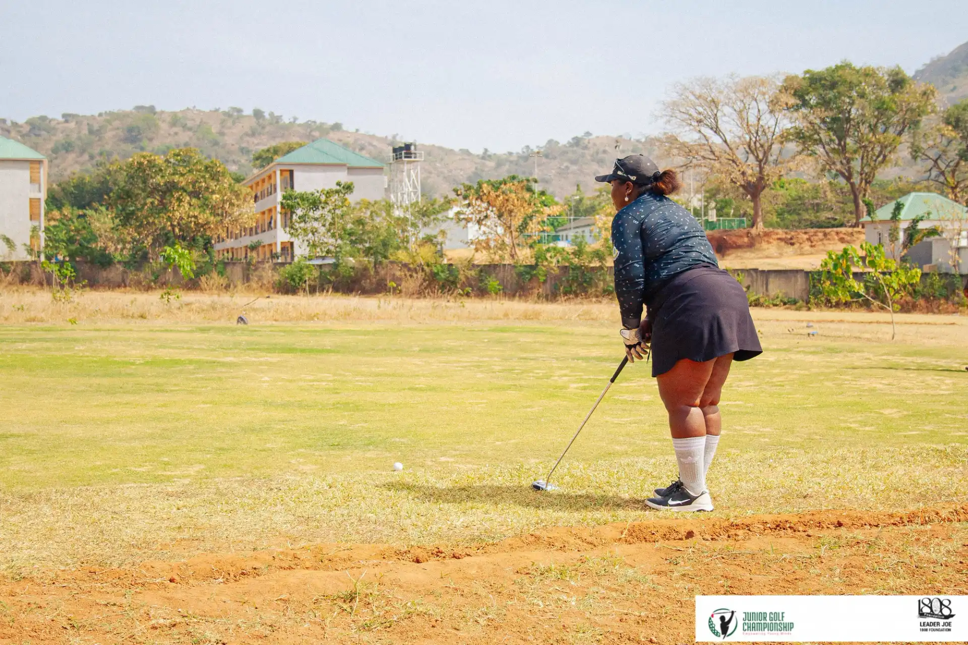 Woman golfing