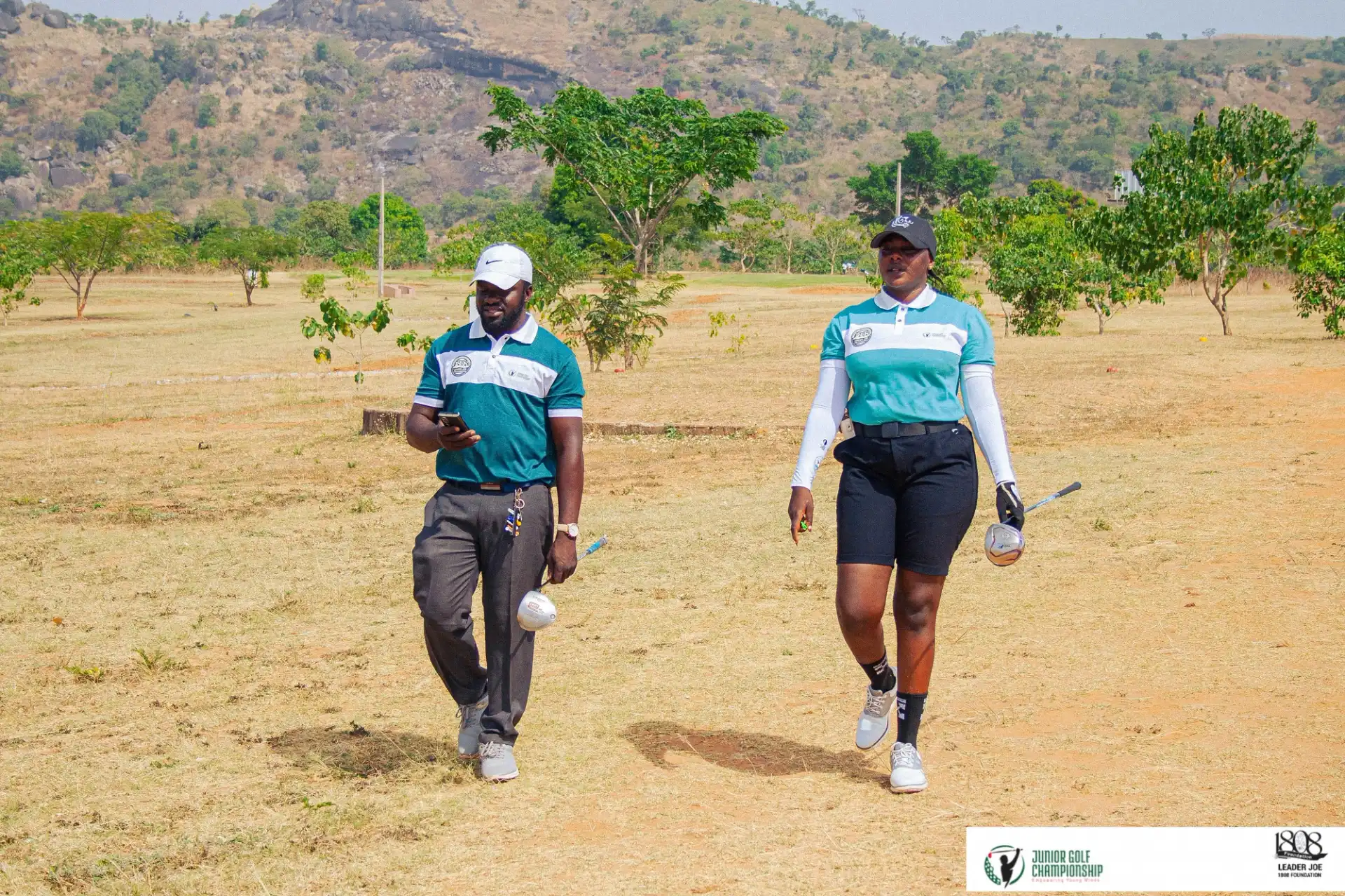 Male and female golfer