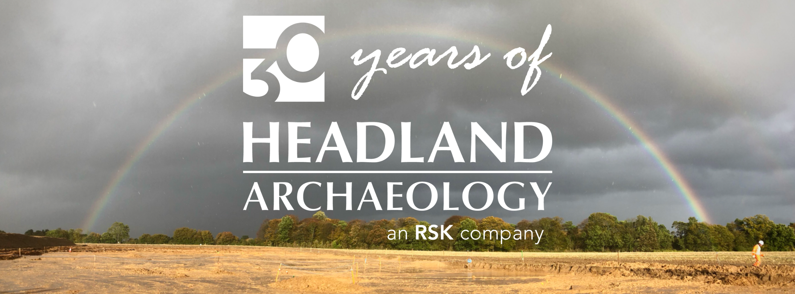 30 years of Headland Archaeology text on top of a grey sky, rainbow and excavation area.