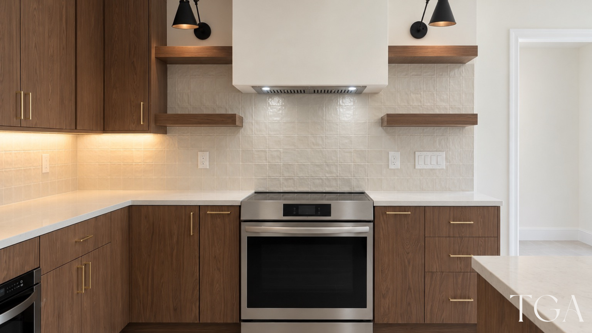 Cooking wall with walnut drawers, a white range hood, wood shelves and black wall lights