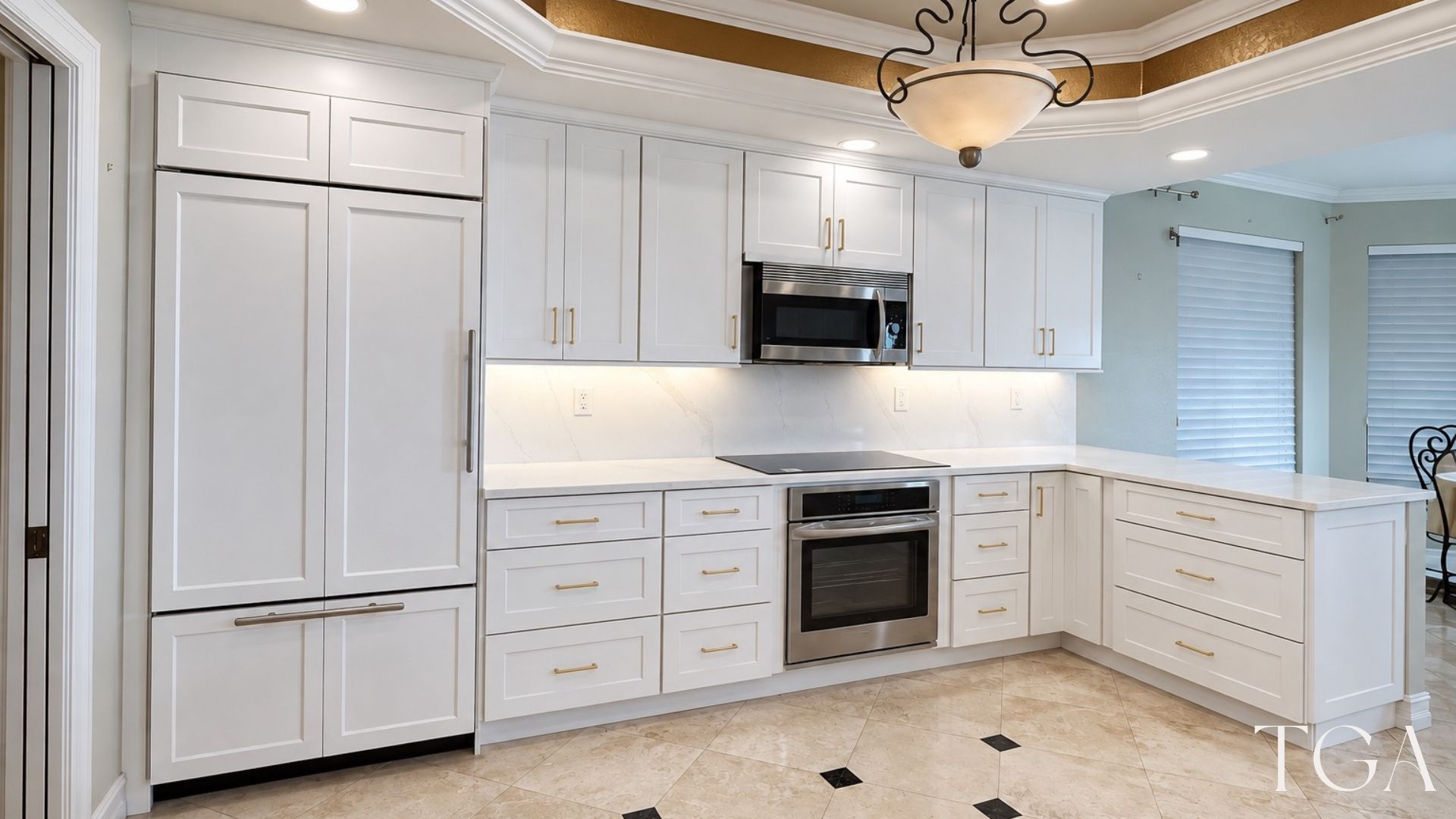 Finished white kitchen in St. Petersburg with tall cabinetry, drawer storage, a light backsplash and an oven beneath the cooktop