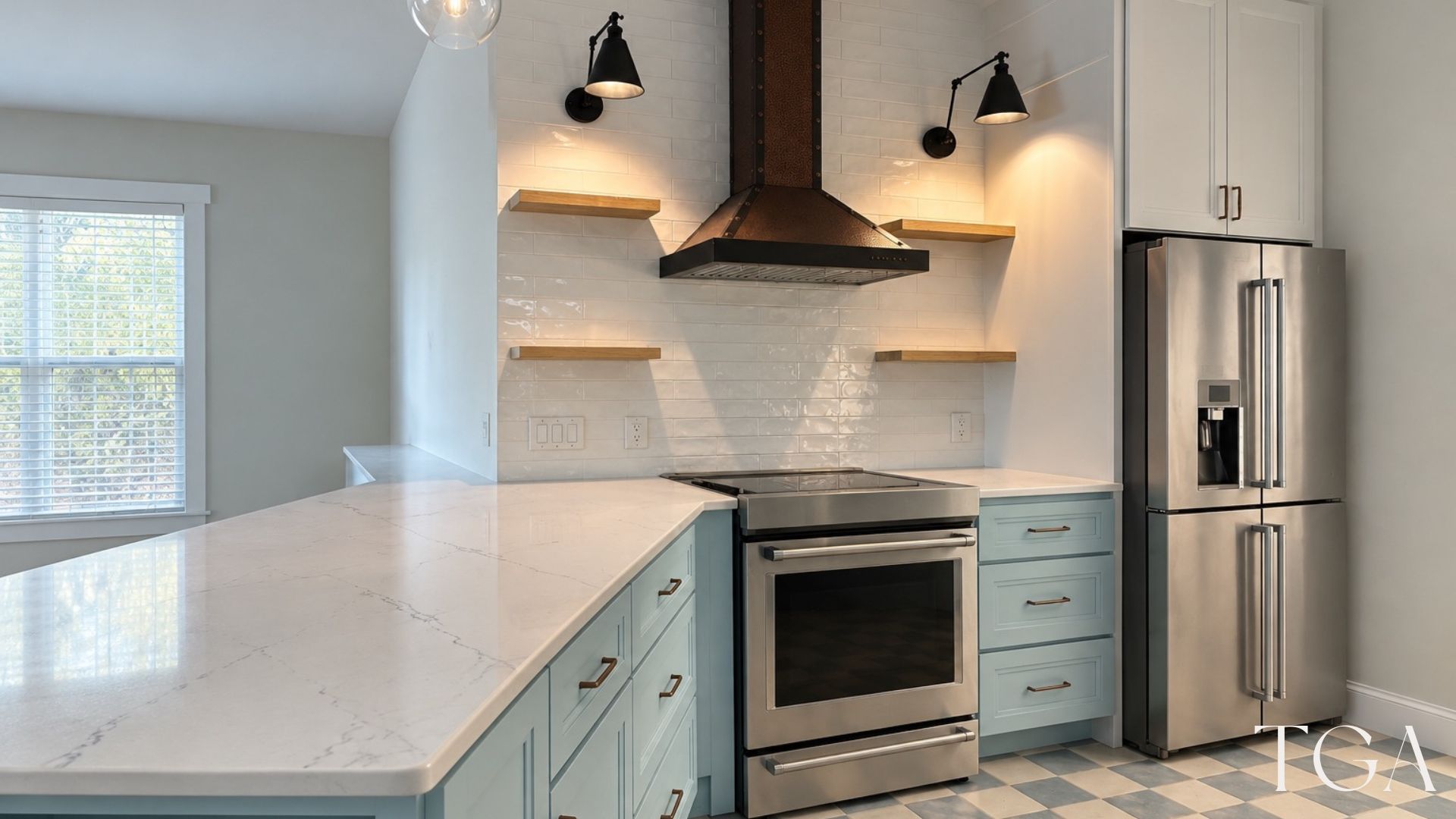 Cooking area with aqua base cabinets, a light counter, copper-toned hood and stainless steel refrigerator