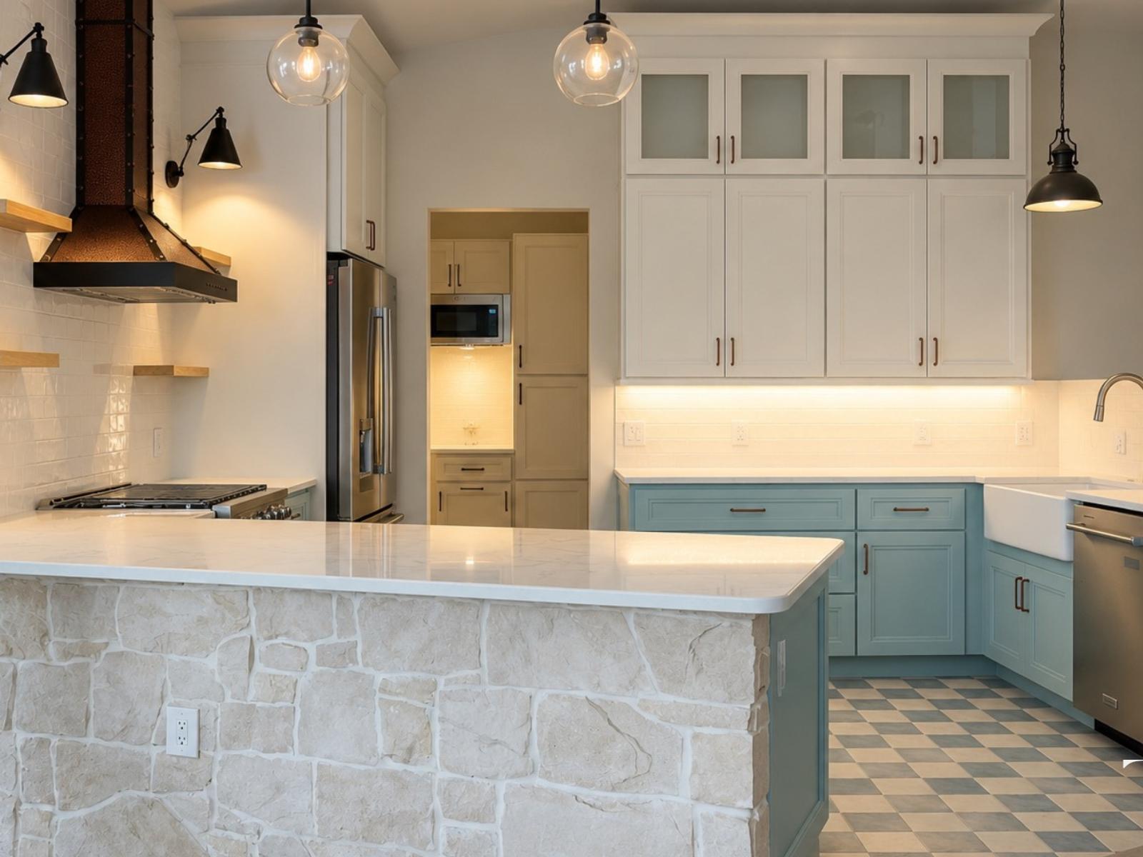 Bradenton kitchen with aqua lower cabinets, white upper cabinets, a copper-toned hood and a checkerboard floor
