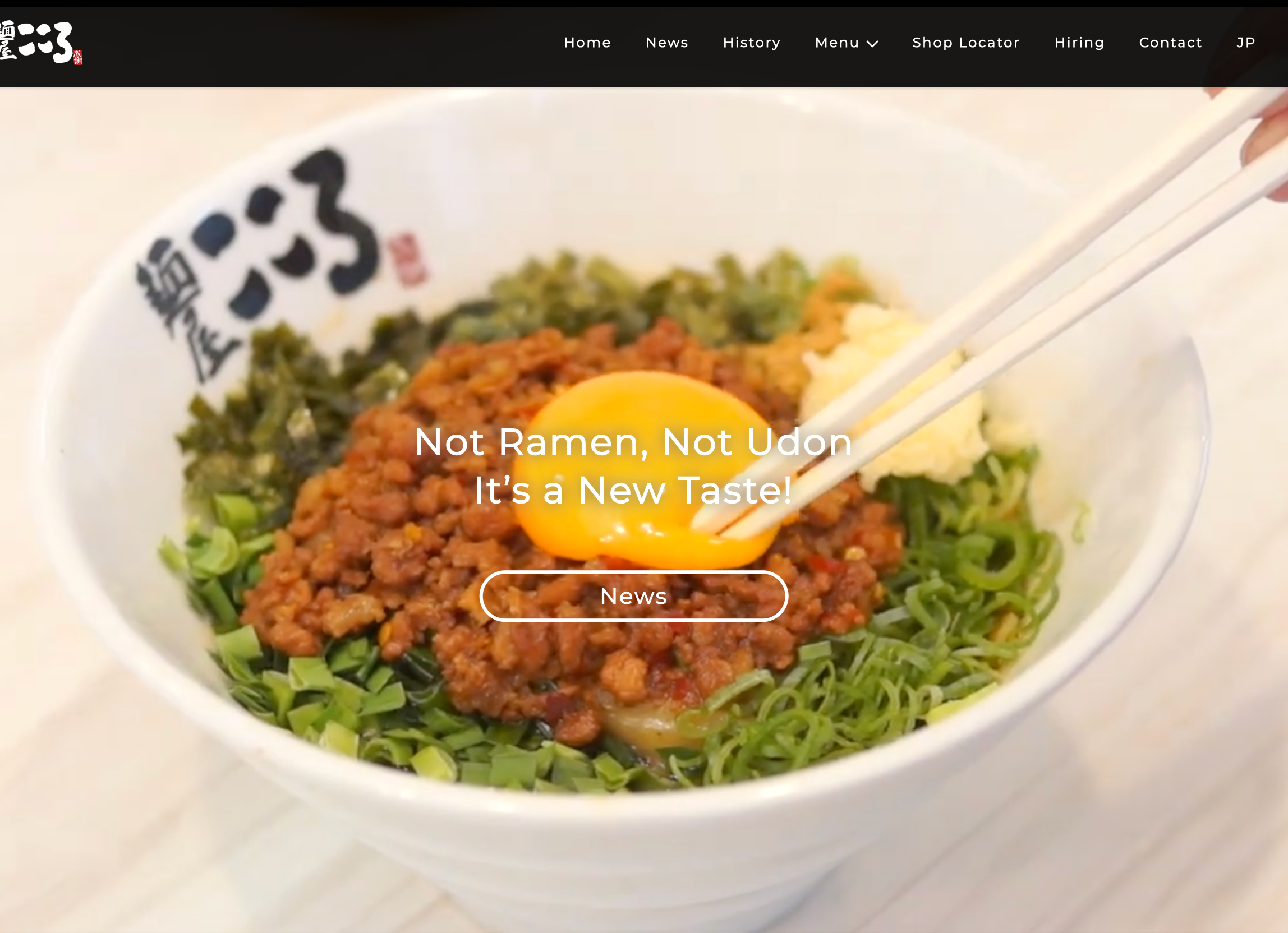 Menya Kokoro Mazesoba bowl with spicy minced meat, raw egg yolk, and green onions