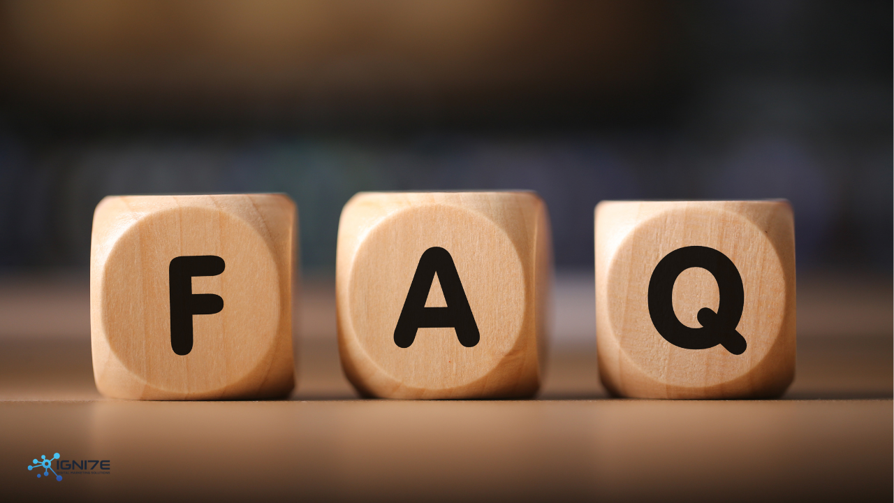 Three wooden blocks spelling out the letters FAQ on a plain surface