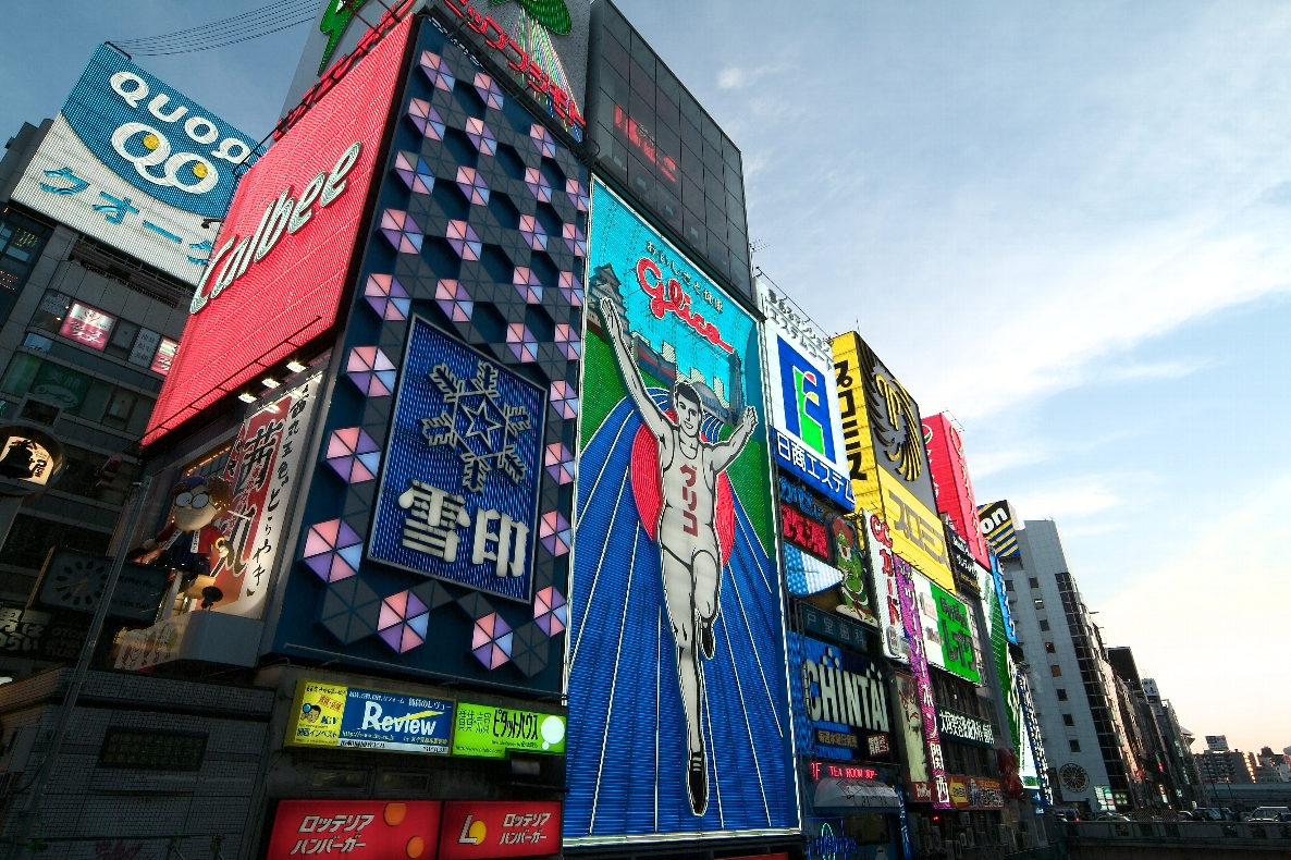 Iconic Glico Man billboard and vibrant neon signs in Dotonbori, Osaka