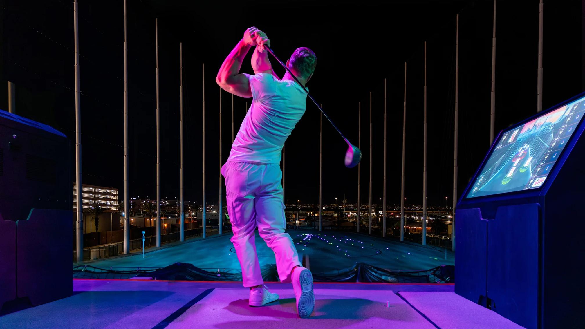 Atomic Golf venue in Las Vegas with multi-level golf bays and entertainment areas