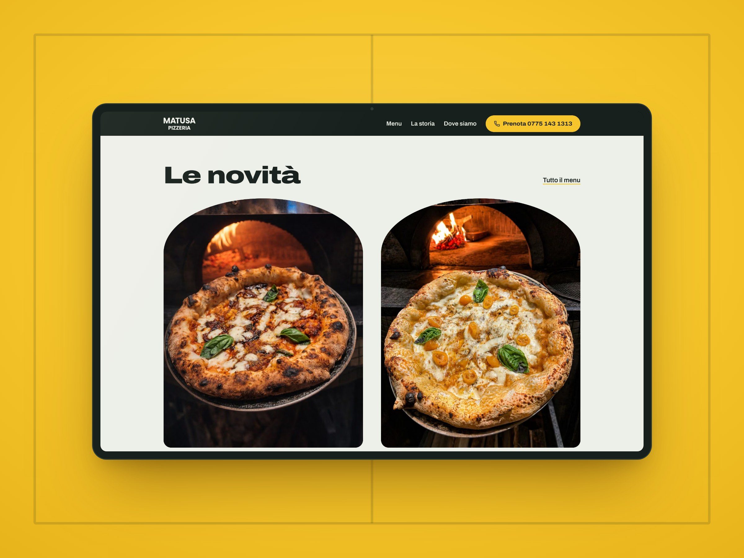 La sezione Le novità del sito di Matusa Pizzeria su uno schermo, con due pizze in cornici ad arco e il forno a legna