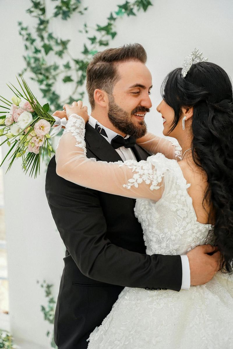 Bride and groom in window light
