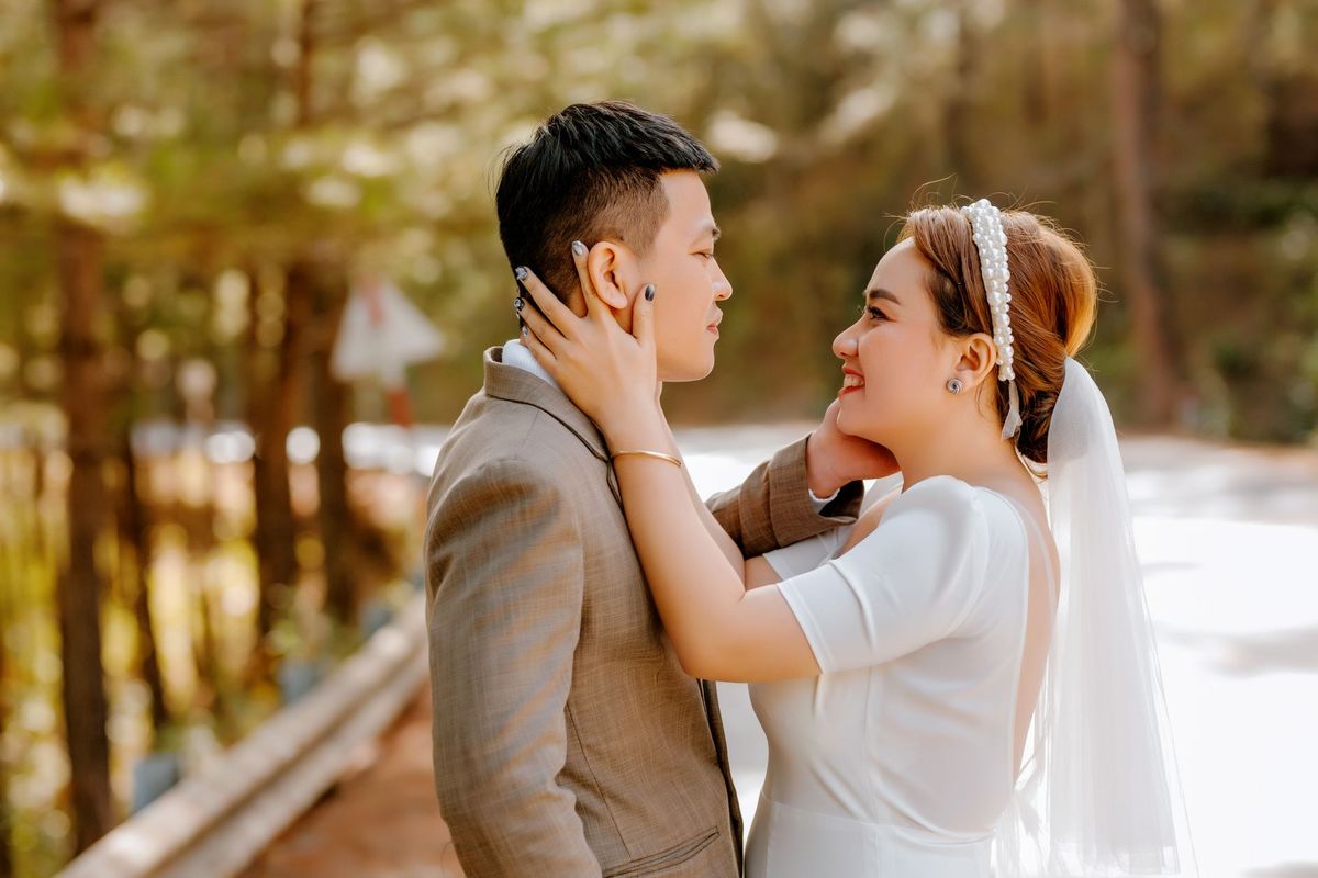 Newlyweds walking through golden light