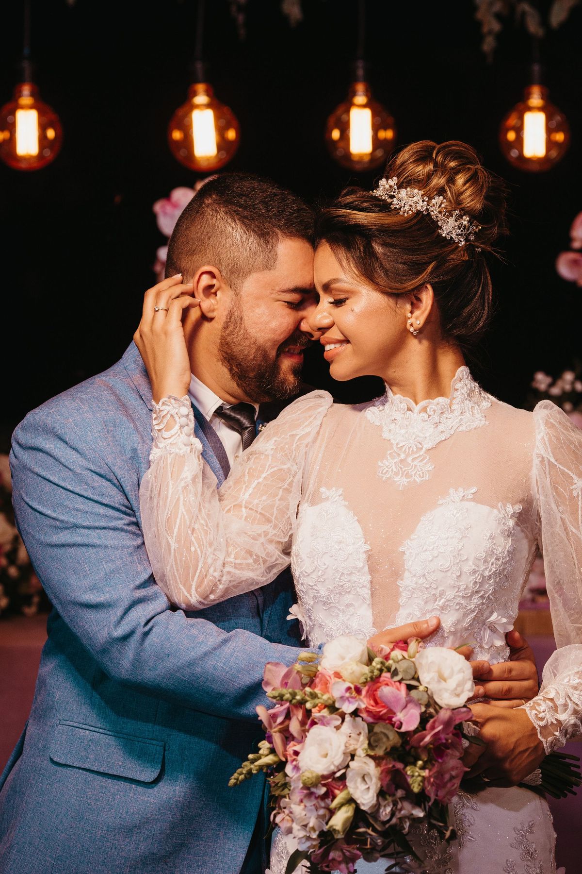Bride and groom holding hands at the altar