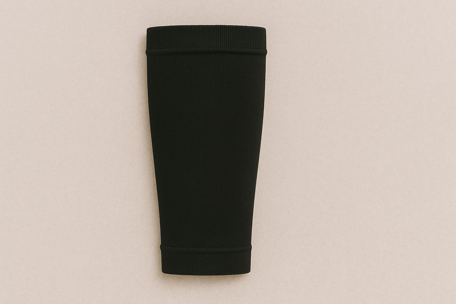 a black tube is sitting on a white surface