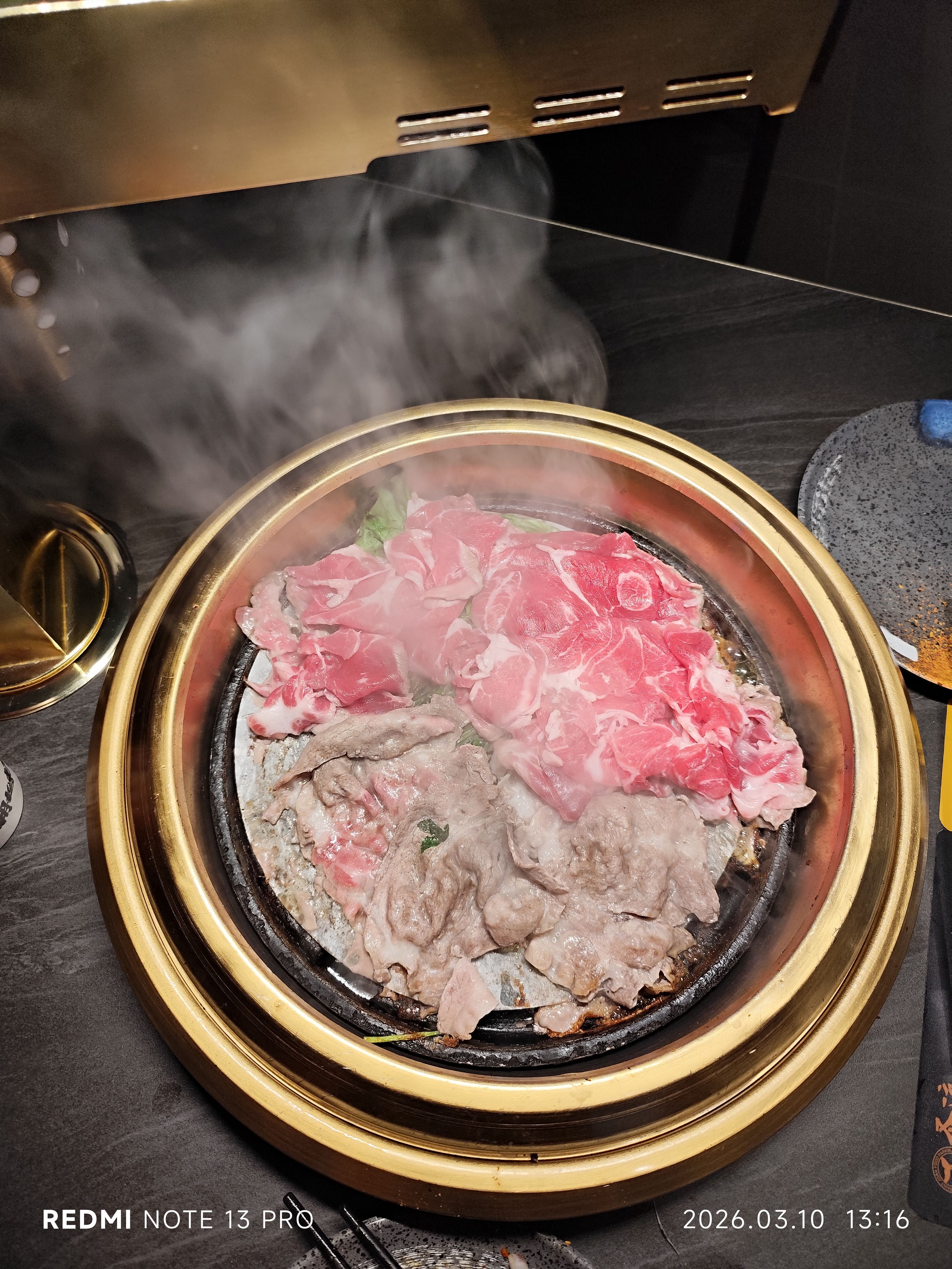 BBQ grill with meat cooking over charcoal