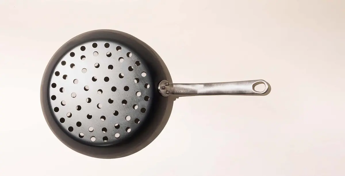 Never lose a shrimp to the coals again with this Frying Pan. 