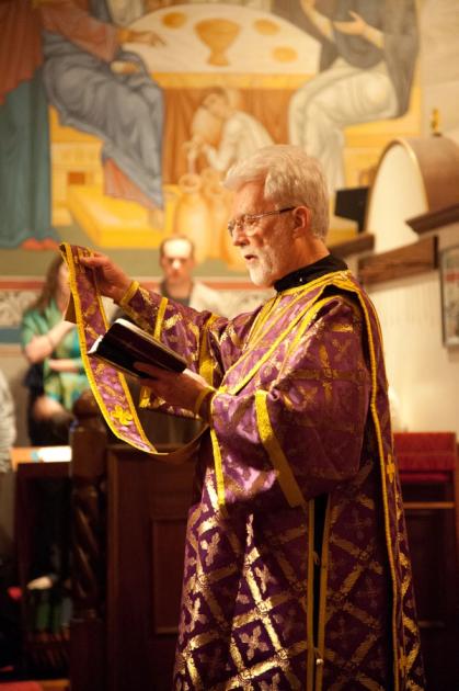 Orthodox deacon reading prayers