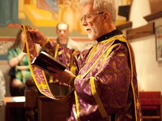 Orthodox deacon reading prayers