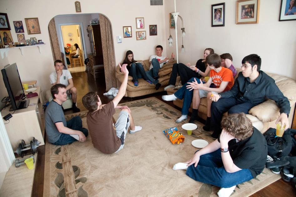 Teens sitting down for church youth group discussion