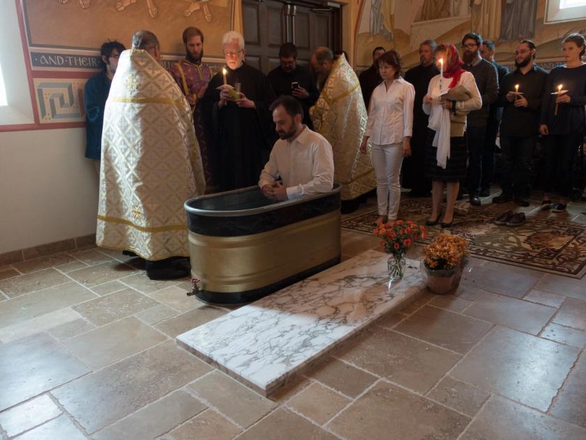 Man in a baptismal font