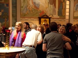 parishioners embracing during Forgiveness Vespers