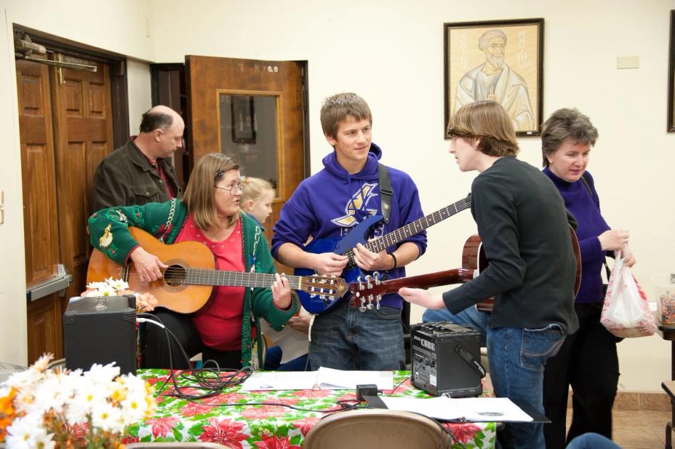 church members playing guitars