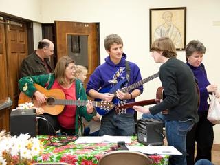 church members playing guitars