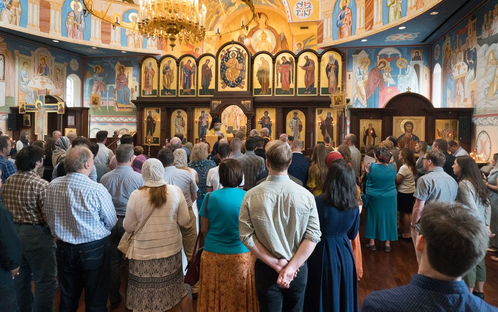 Orthodox congregation standing in attendance at Divine Liturgy 