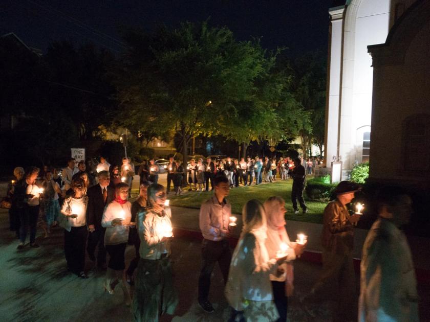 People holding candles during a Paschal vigil and procession