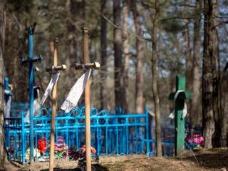 Crosses with white scarves in a cemetery