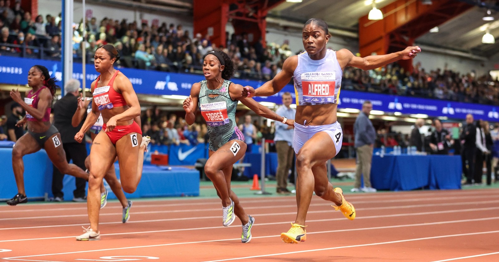 Julien Alfred wins the 60m at the 2024 Millrose Games in 6.99s.