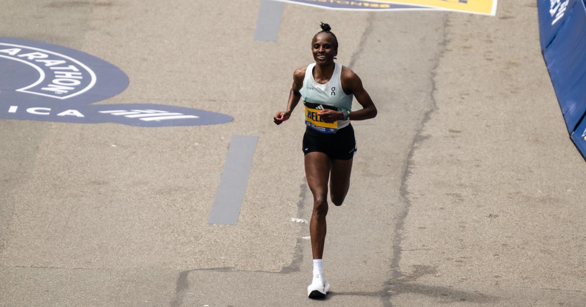 Hellen Obiri all smiles as she approaches the finish line to successfully defend her Boston Marathon crown. 