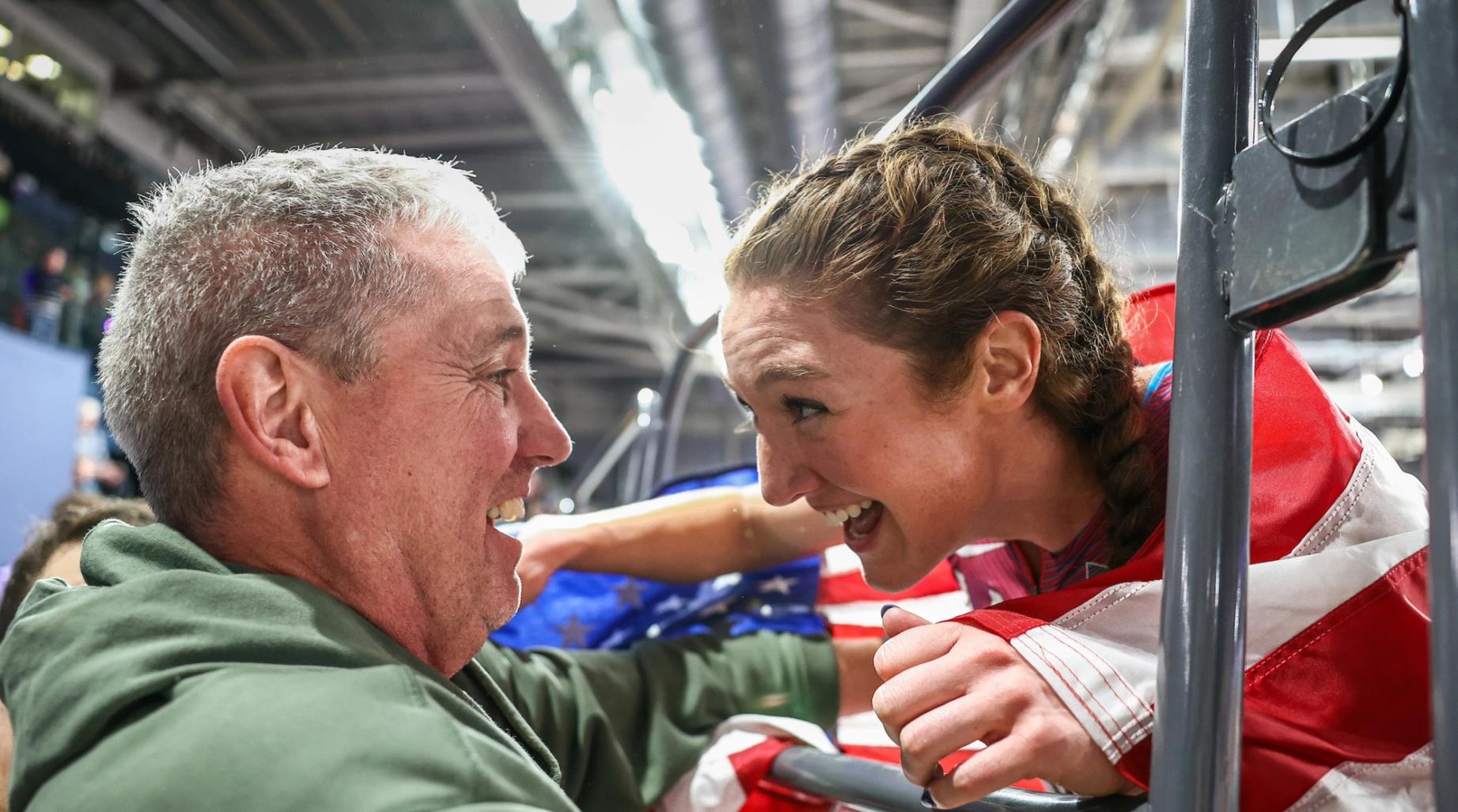 Emily Mackay celebrating with her coach, March Coogan, after placing third at the 2024 World Athletics Indoor Championships.