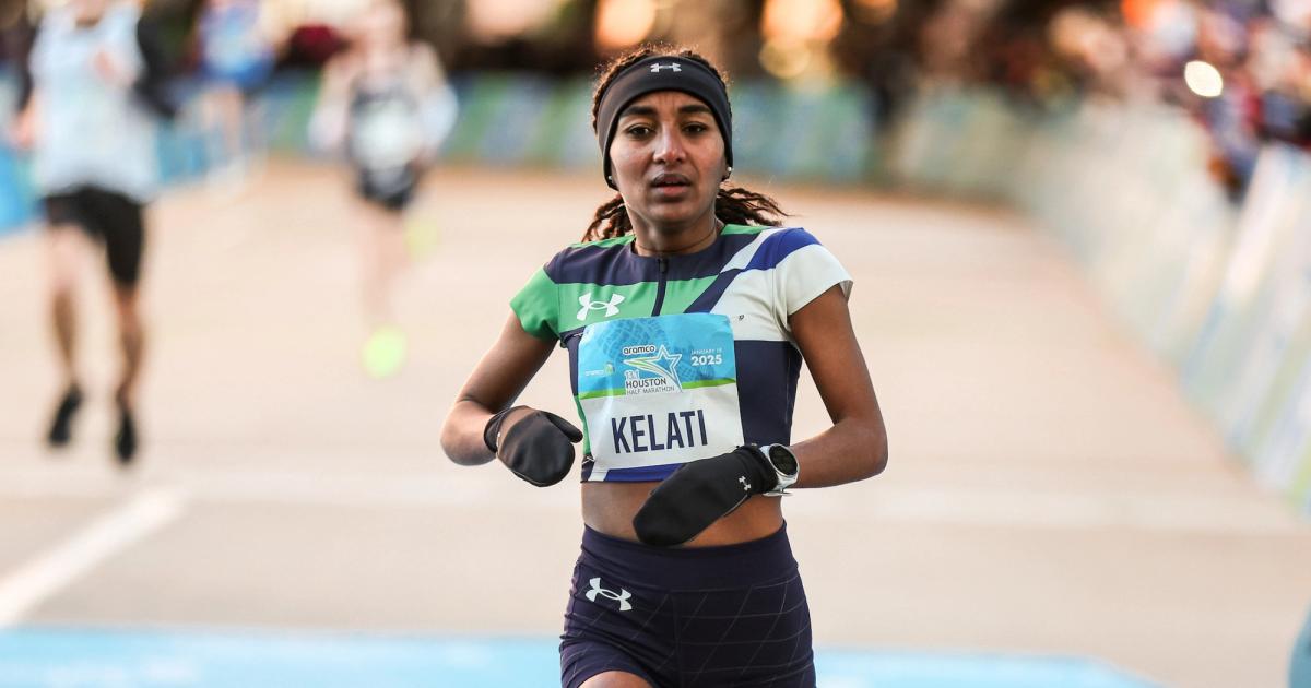 Weini Kelati crosses the finish line of the 2025 Houston Half Marathon.