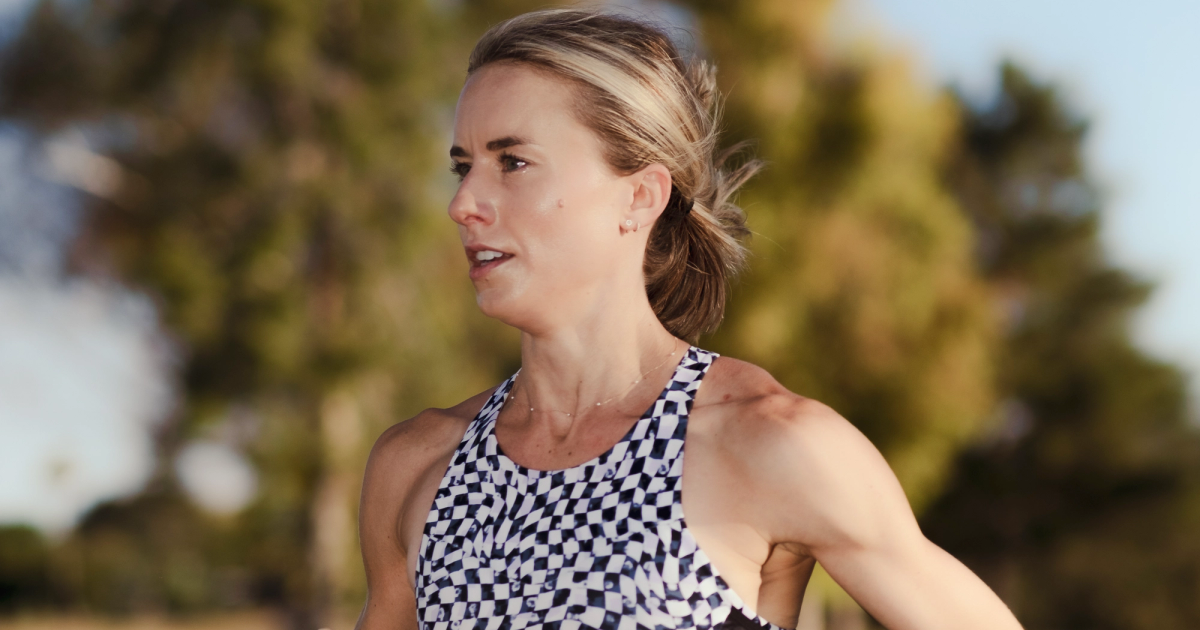 Jess McClain signs with Brooks Running in 2024.