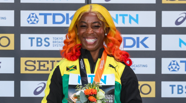 Shelly-Ann Fraser-Pryce on the podium at the 2023 World Athletics Championships.