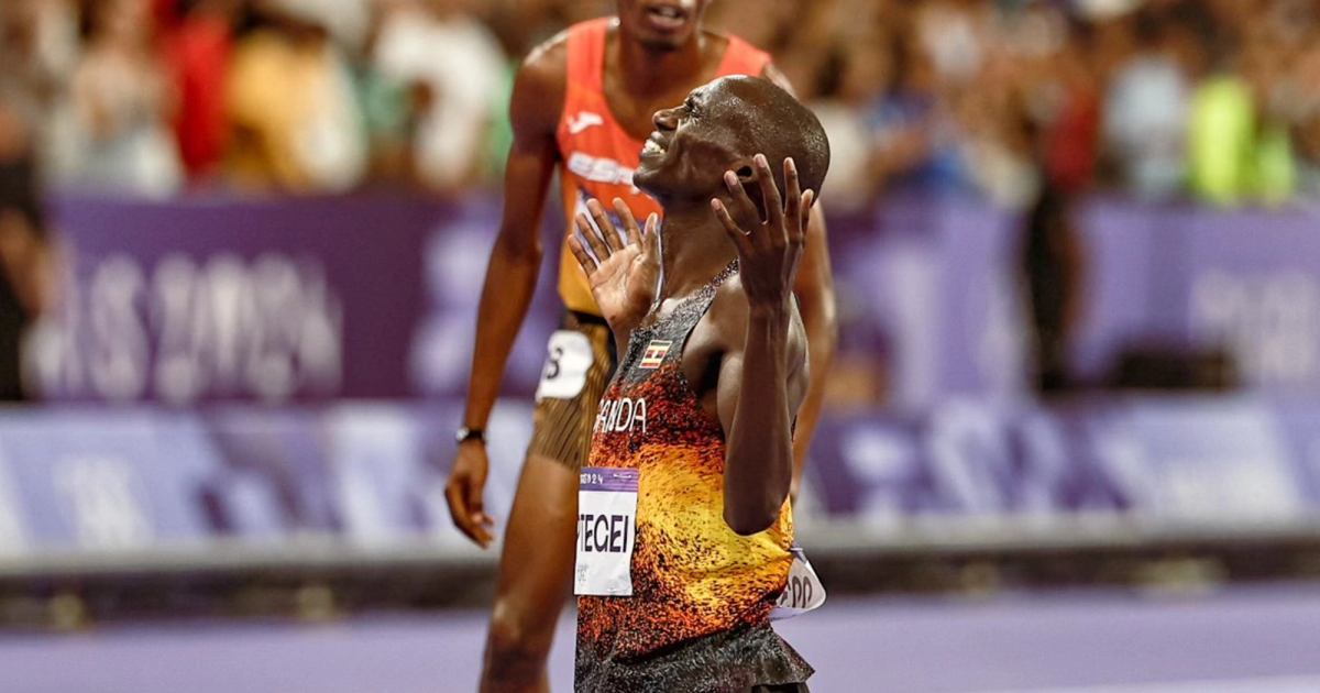 Joshua Cheptegei celebrates his Olympic title in the men's 10,000m.