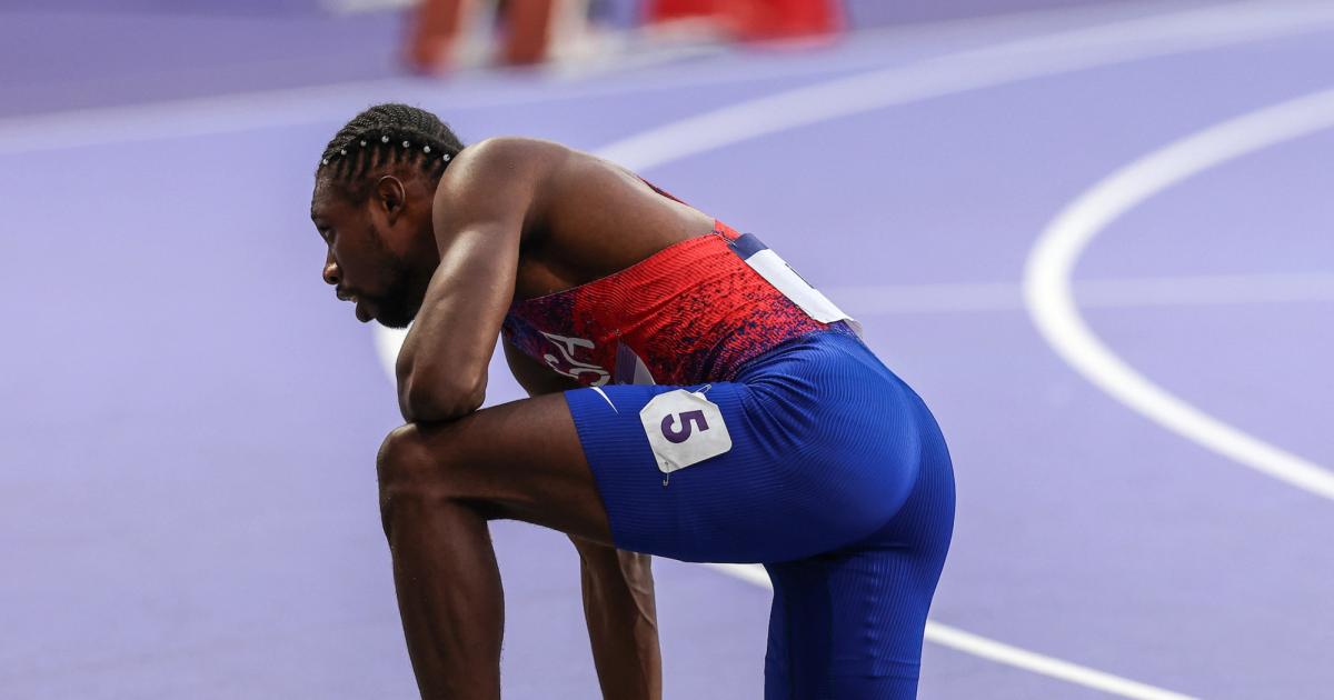 Noah Lyles hits the track after the 200m final at the Paris Olympics.
