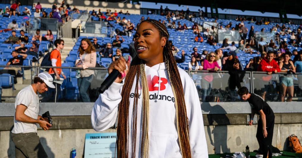 Katelyn Hutchison on the mic at Trials of Miles' Track Night NYC.