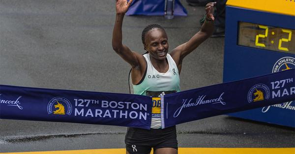 Helen Obiri breaking the tape at the 2023 Boston Marathon.