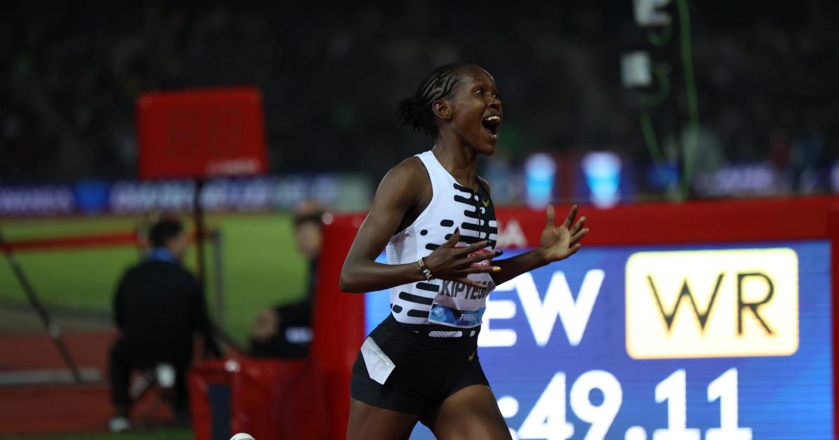 Faith Kipyegon celebrates winning the Florence Diamond League women's 1500 meters, shattering the world record.