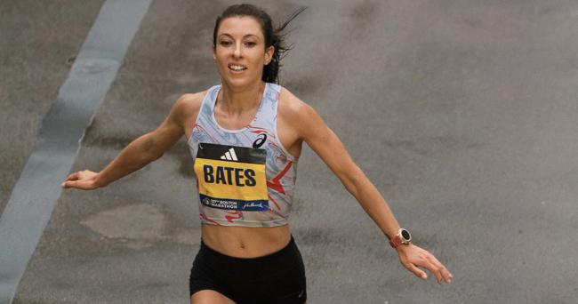 Emma Bates celebrates finishing as the top American, fifth place overall at the 2023 Boston Marathon