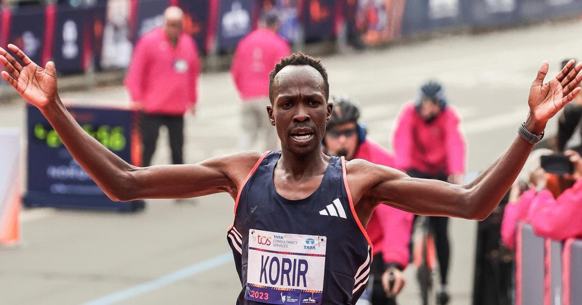 Albert Korir crosses the finish line of the 2023 New York City Marathon.