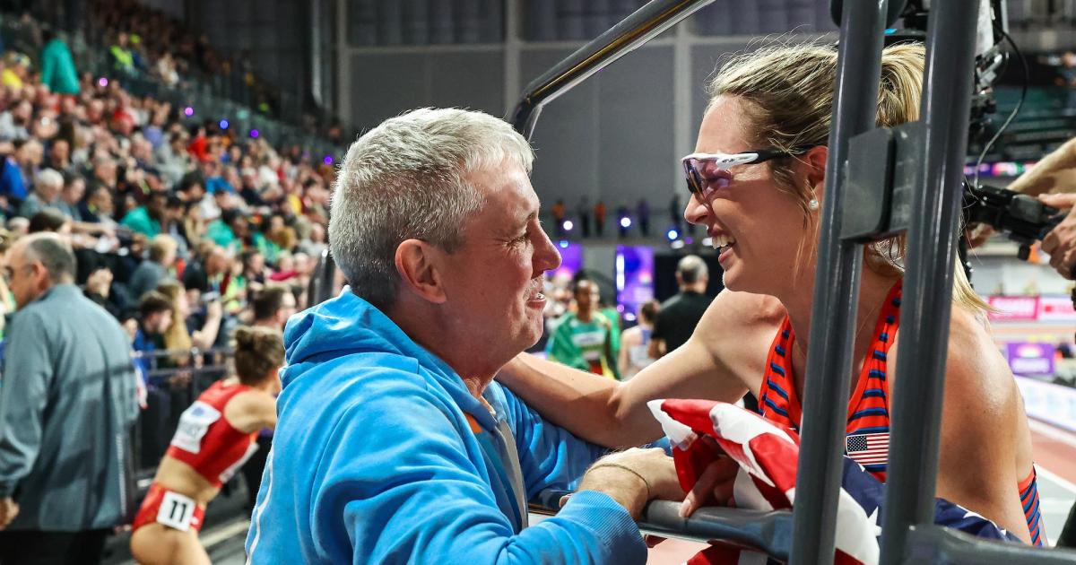 Mark Coogan and Elle St. Pierre celebrate her gold medal at the 2024 World Indoor Championships.