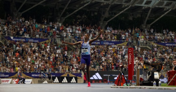 Ethiopia's Lamecha Girma breaks the 3000m steeplechase world record.