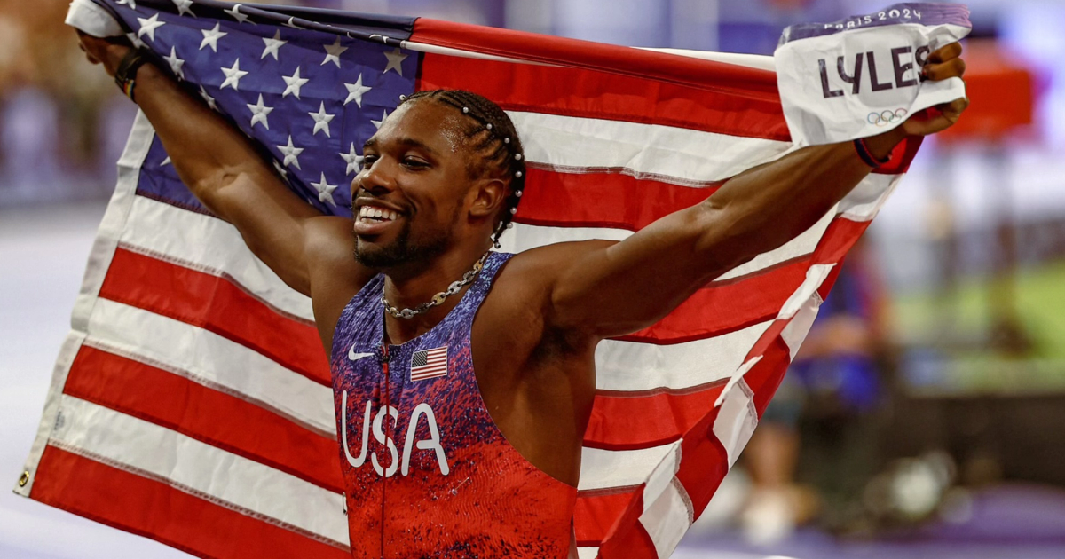 Noah Lyles celebrating his Olympic crown in the men's 100m