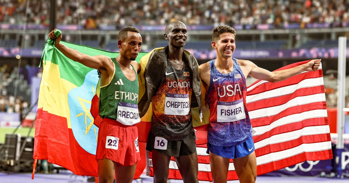 Berihu Aregawi, Joshua Cheptegei, and Grant Fisher after landing on the Olympic podium over 10,000m.