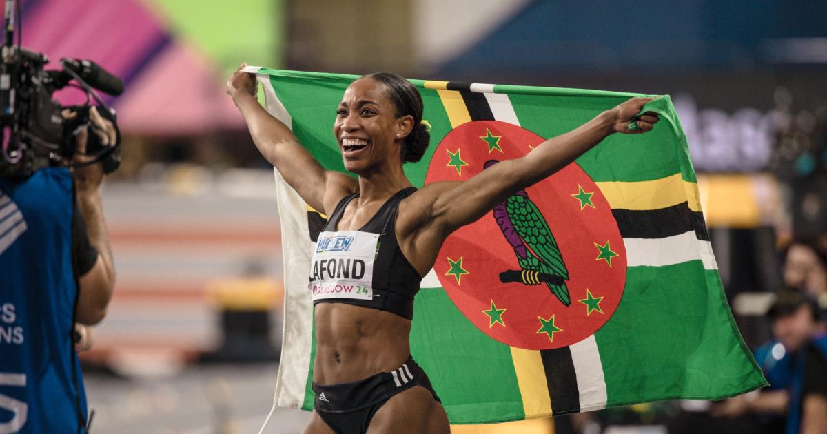 Thea LaFond celebrates her historic gold medal in the triple jump at the 2024 World Indoor Championships in Glasgow.