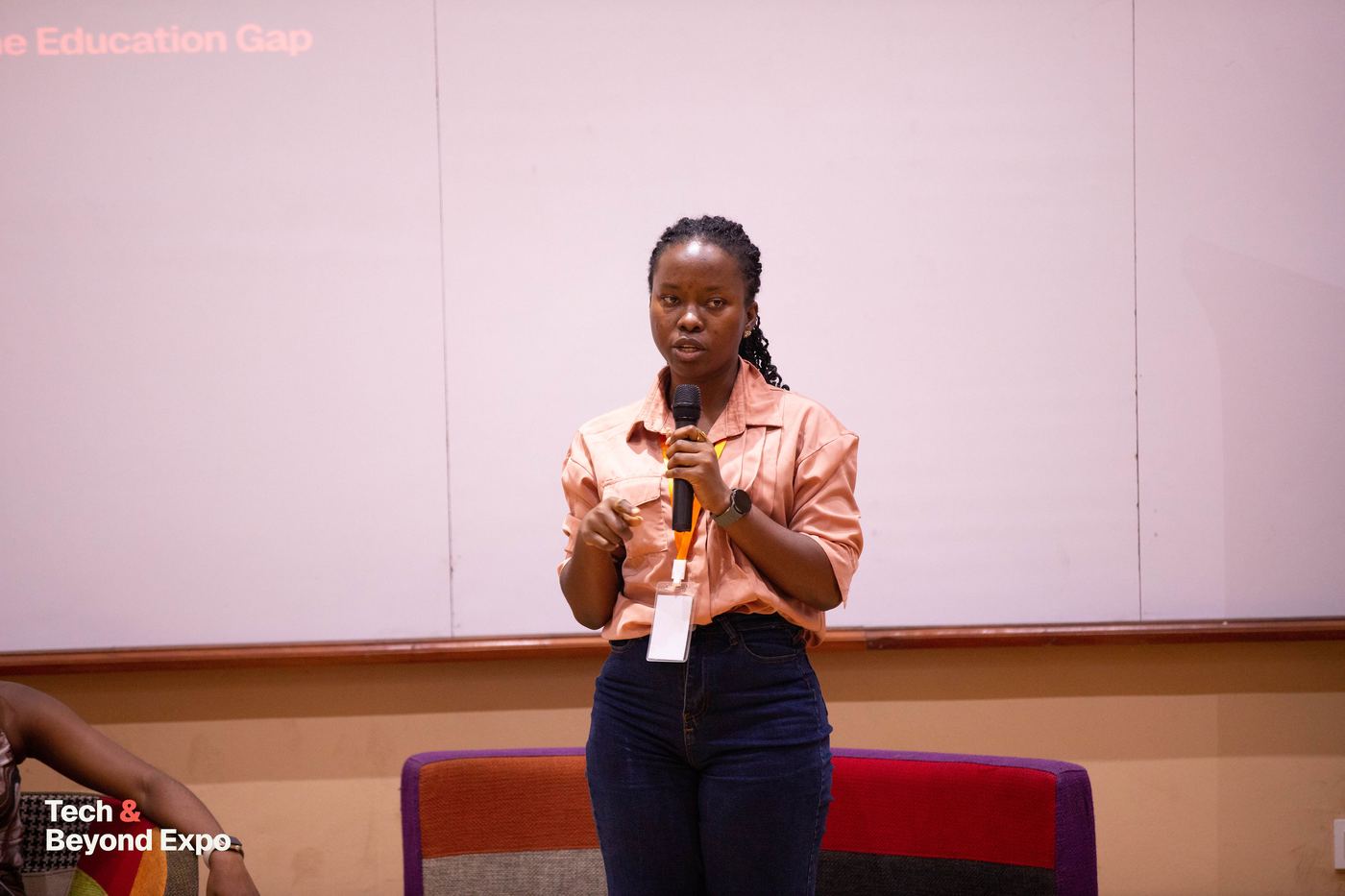 A panellist speaking with a microphone